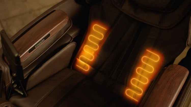 Close-up of a brown massage chair with glowing orange heated massage pads on the backrest and armrests.