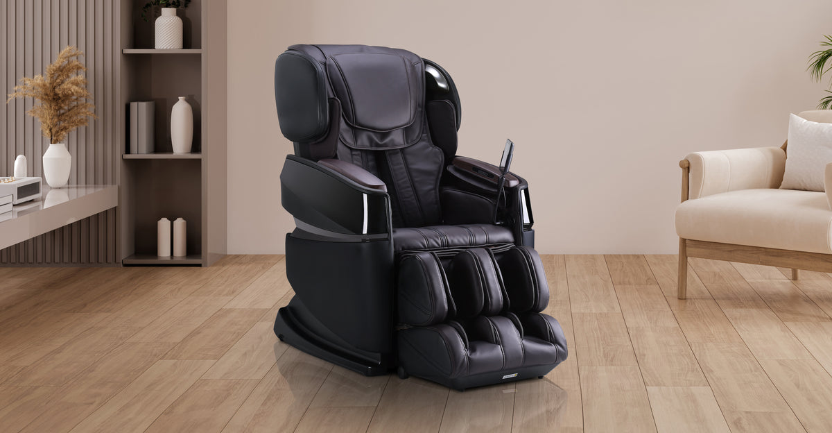Black Cozzia massage chair with padded headrest, armrests, and leg massage zones.